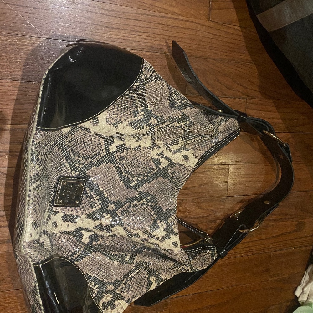 Dooney and Bourke embossed leather purse with patent leather
